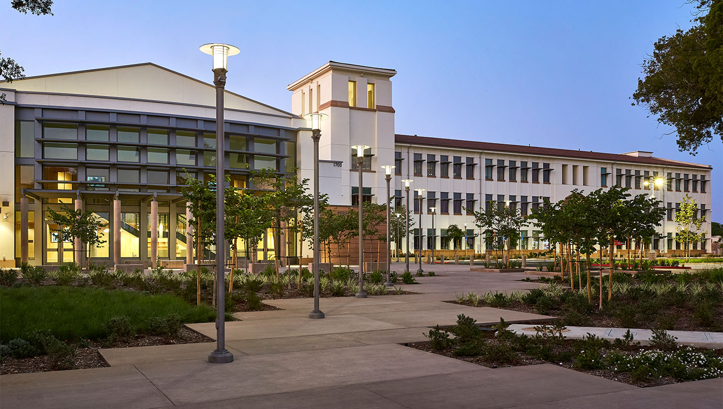 Eclipse luminaires light high school exterior at dusk